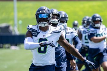 Jun 11, 2025; Renton, WA, USA; Seattle Seahawks defensive end DeMarcus Lawrence (0) takes part in drills during mini-camp at Virginia Mason Athletic Center. Mandatory Credit: Stephen Brashear-Imagn Images