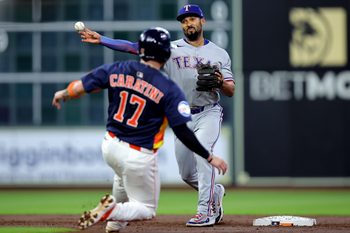 Jul 13, 2025; Houston, Texas, USA; Texas Rangers second baseman Marcus Semien (2) throws a fielded ball to first base to complete a double play against the Houston Astros during the second inning at Daikin Park. Mandatory Credit: Erik Williams-Imagn Images