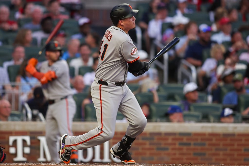 Jul 21, 2025; Atlanta, Georgia, USA; San Francisco Giants first baseman Wilmer Flores (41) hits a single against the Atlanta Braves in the fourth inning at Truist Park. Mandatory Credit: Brett Davis-Imagn Images