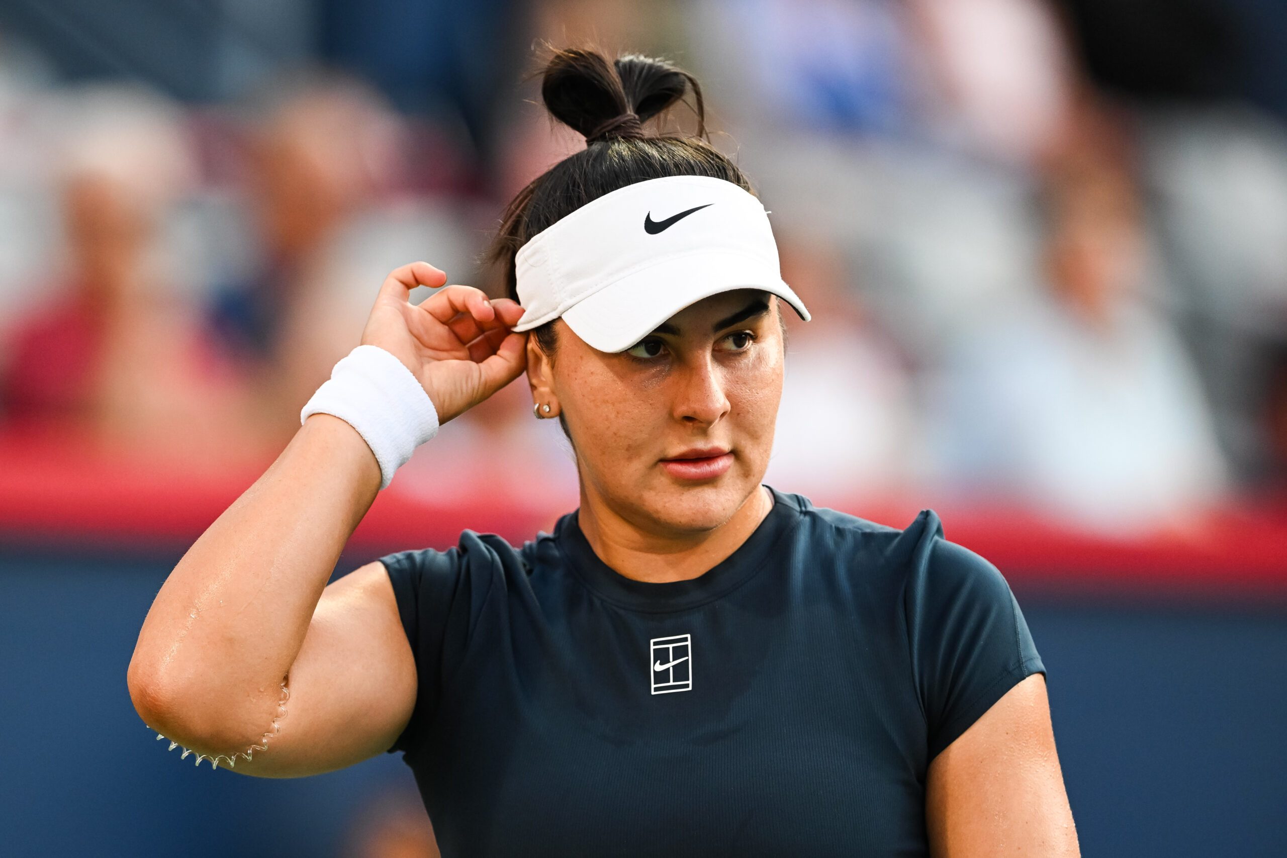 Jul 27, 2025; Montreal, QC, Canada; Bianca Andreescu (CAN) looks on against Barbora Krejcikova (CZE) in first round play at IGA Stadium. Mandatory Credit: David Kirouac-Imagn Images