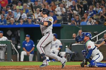 Jul 28, 2025; Kansas City, Missouri, USA;  Atlanta Braves third baseman Austin Riley (27) hits a solo home run in the seventh inning against the Kansas City Royals at Kauffman Stadium. Mandatory Credit: Peter Aiken-Imagn Images
