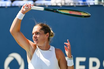 Aug 1, 2025; Montreal, QC, Canada; Caty Mcnally (USA) returns the ball to Madison Keys (USA) in third round play at IGA Stadium. Mandatory Credit: David Kirouac-Imagn Images