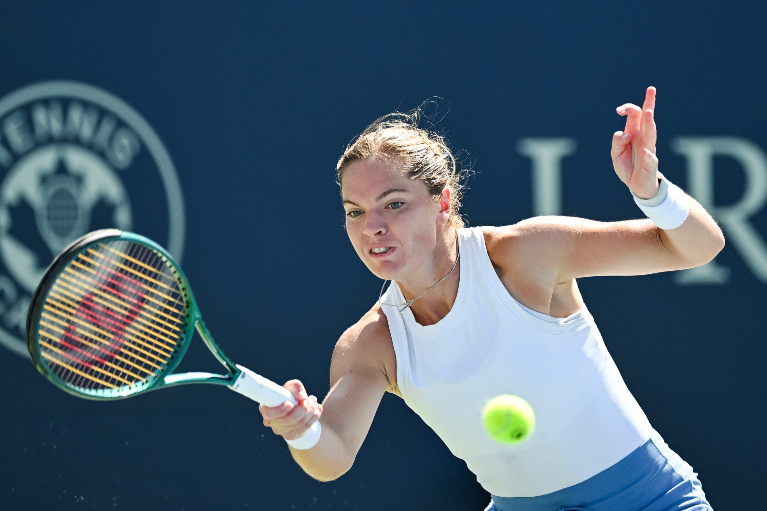 Aug 1, 2025; Montreal, QC, Canada; Caty Mcnally (USA) returns the ball to Madison Keys (USA) in third round play at IGA Stadium. Mandatory Credit: David Kirouac-Imagn Images