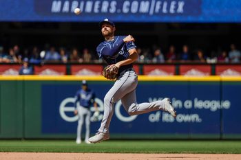 Aug 10, 2025; Seattle, Washington, USA; Tampa Bay Rays second baseman Brandon Lowe (8) throws to first base against the Seattle Mariners during the seventh inning at T-Mobile Park. Mandatory Credit: Joe Nicholson-Imagn Images