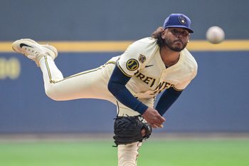 Aug 12, 2025; Milwaukee, Wisconsin, USA; Milwaukee Brewers starting pitcher Freddy Peralta (51) throws a pitch in the first inning against the Pittsburgh Pirates at American Family Field. Mandatory Credit: Benny Sieu-Imagn Images