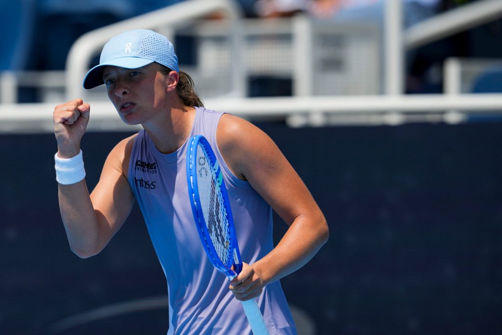 Aug 17, 2025; Cincinnati, OH, USA;  Iga Swiatek (POL) reacts after returning a shot against Elena Rybakina (KAZ) during the Cincinnati Open at the Lindner Family Tennis Center. Mandatory Credit: Aaron Doster-Imagn Images