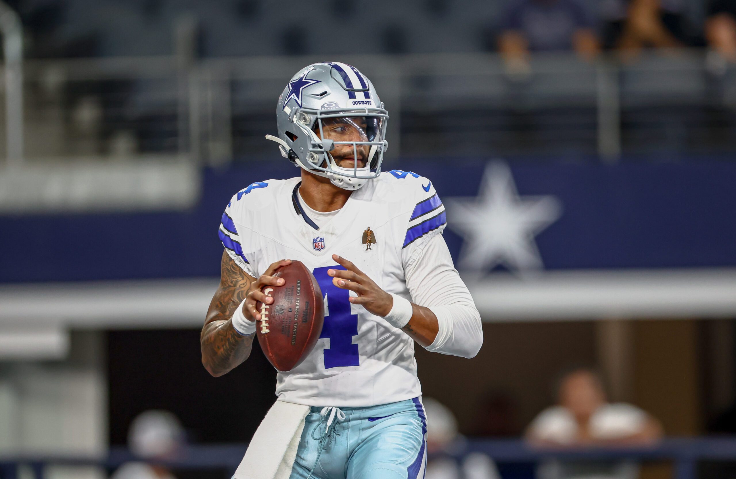 Aug 16, 2025; Arlington, Texas, USA;  Dallas Cowboys quarterback Dak Prescott (4) warms up before the game against the Baltimore Ravens at AT&T Stadium. Mandatory Credit: Kevin Jairaj-Imagn Images