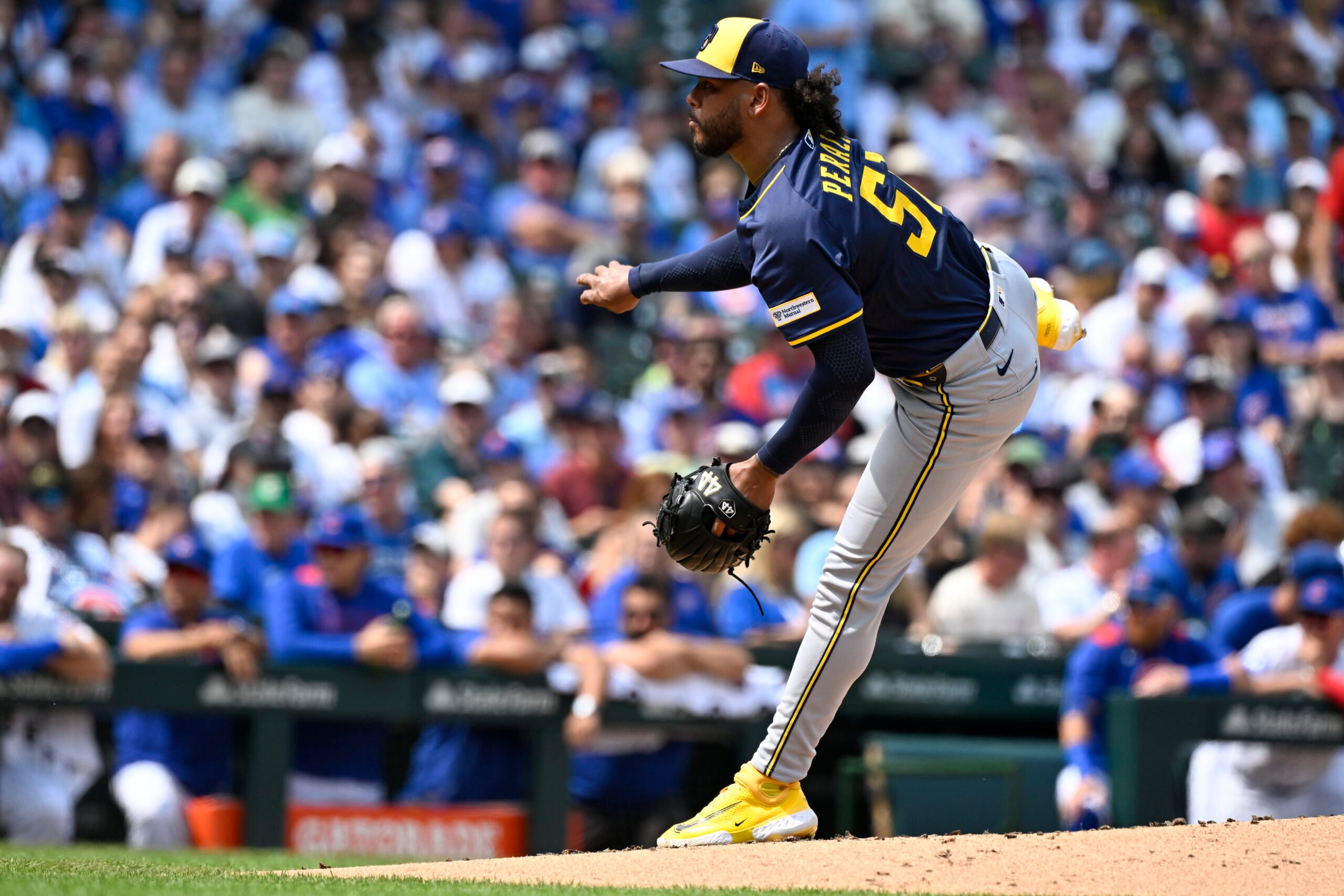 Aug 18, 2025; Chicago, Illinois, USA;  Milwaukee Brewers pitcher Freddy Peralta (51) delivers during the second inning against the Chicago Cubs at Wrigley Field. Mandatory Credit: Matt Marton-Imagn Images