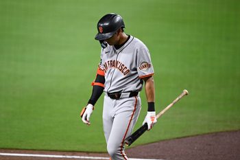 Aug 20, 2025; San Diego, California, USA; San Francisco Giants center fielder Jung Hoo Lee (51) walks back to the dugout after striking out during the seventh inning against the San Diego Padres at Petco Park. Mandatory Credit: Denis Poroy-Imagn Images