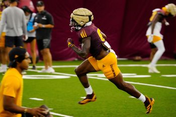 Arizona State running back Kanye Udoh (6) runs in a drill during a practice inside the Verde Dickey Dome in Tempe on Aug. 12, 2025.