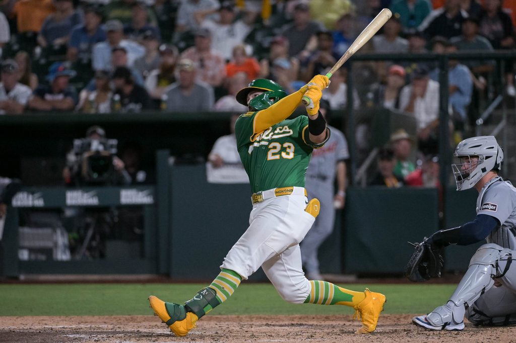 Aug 25, 2025; West Sacramento, California, USA; Athletics catcher Shea Langeliers (23) hits a grand slam against the Detroit Tigers during the seventh inning at Sutter Health Park. Mandatory Credit: Ed Szczepanski-Imagn Images