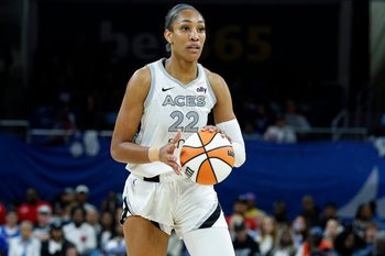 Aug 25, 2025; Chicago, Illinois, USA; Las Vegas Aces center A'ja Wilson (22) brings the ball up court during the second half of a WNBA game against the Chicago Sky at Wintrust Arena. Mandatory Credit: Kamil Krzaczynski-Imagn Images