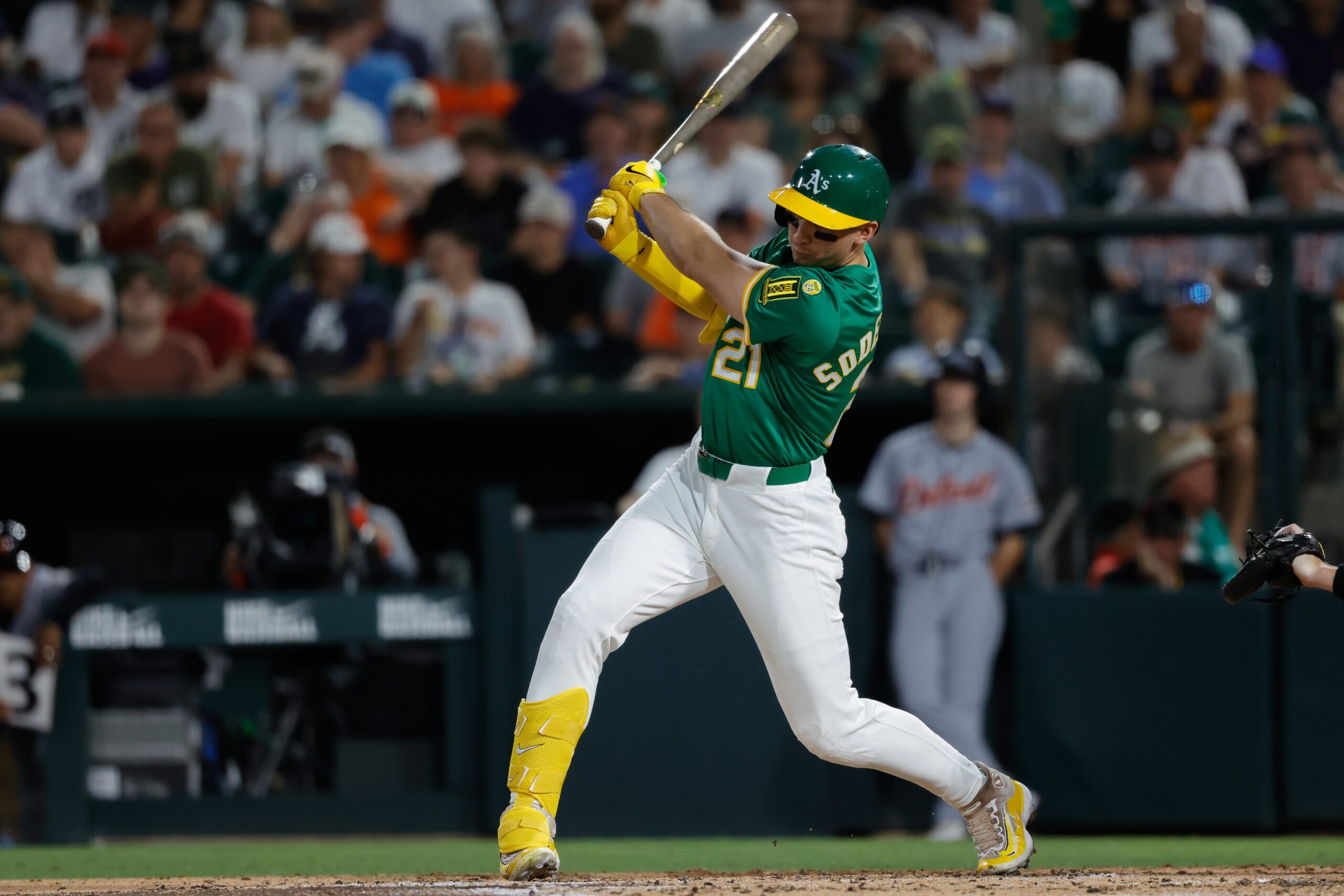 Aug 26, 2025; West Sacramento, California, USA; Athletics left fielder Tyler Soderstrom (21) hits an RBI single during the third inning against the Detroit Tigers at Sutter Health Park. Mandatory Credit: Sergio Estrada-Imagn Images
