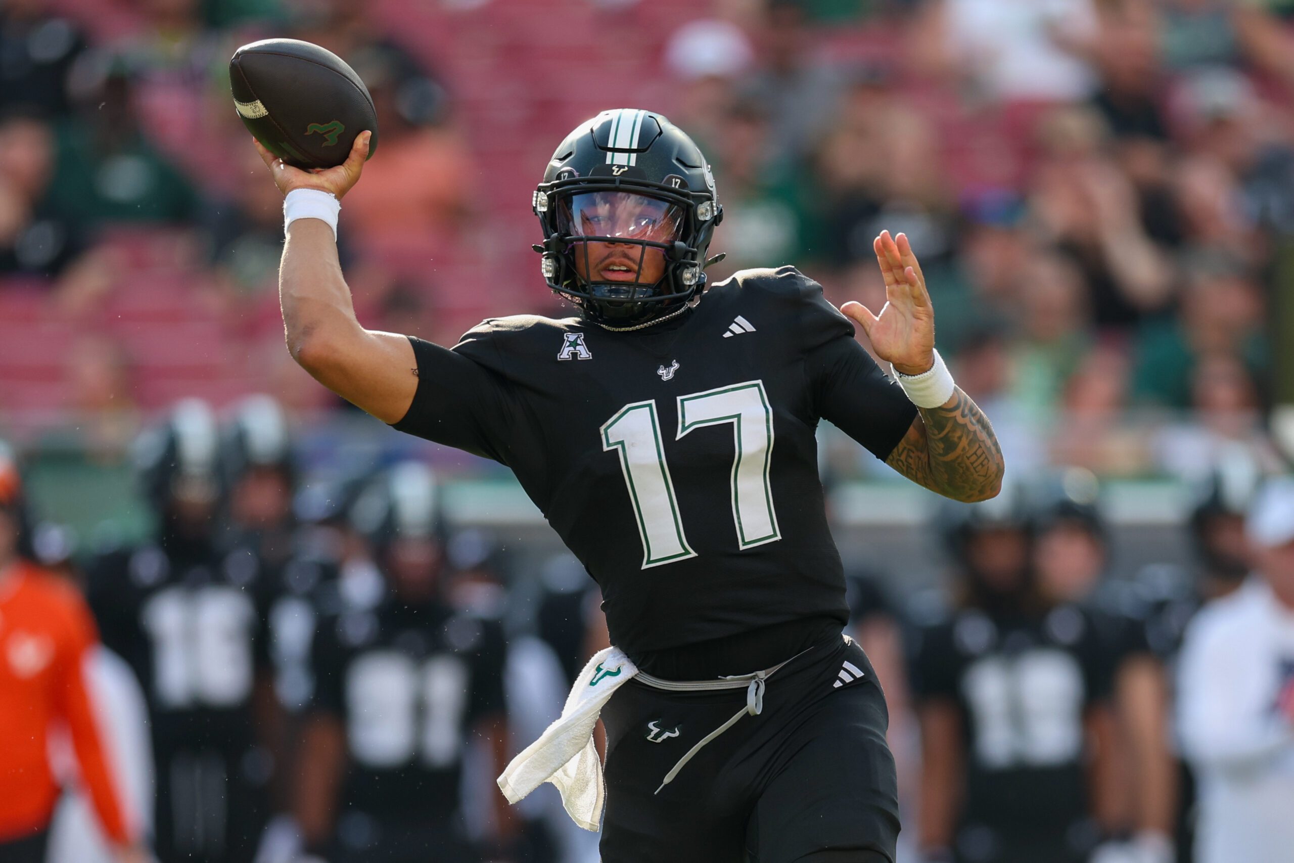 Aug 28, 2025; Tampa, Florida, USA; South Florida Bulls quarterback Byrum Brown (17) throws a pass against the Boise State Broncos in the first quarter at Raymond James Stadium. Mandatory Credit: Nathan Ray Seebeck-Imagn Images