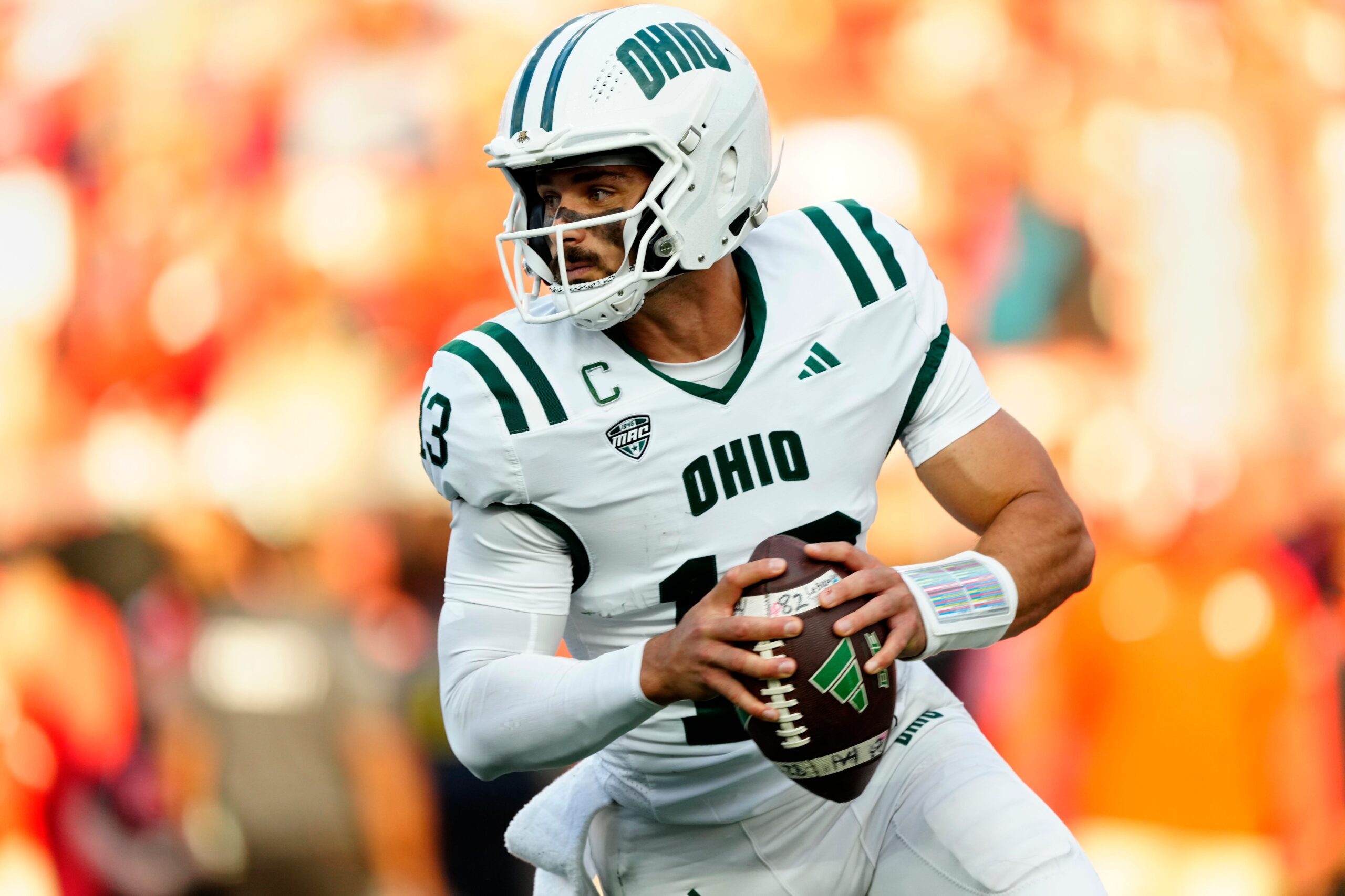 Ohio Bobcats quarterback Parker Navarro (13) looks for an open teammate, Thursday, August 28, 2025.