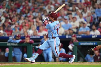 Aug 28, 2025; Philadelphia, Pennsylvania, USA; Philadelphia Phillies designated hitter Kyle Schwarber (12) hits a two-run home run against the Atlanta Braves in the fourth inning at Citizens Bank Park. Mandatory Credit: Kyle Ross-Imagn Images