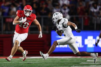 Aug 28, 2025; Piscataway, New Jersey, USA;  Rutgers Scarlet Knights tight end Colin Weber (18) gains yards after catch as Ohio Bobcats safety DJ Walker (2) pursues during the second half at SHI Stadium. Mandatory Credit: Vincent Carchietta-Imagn Images