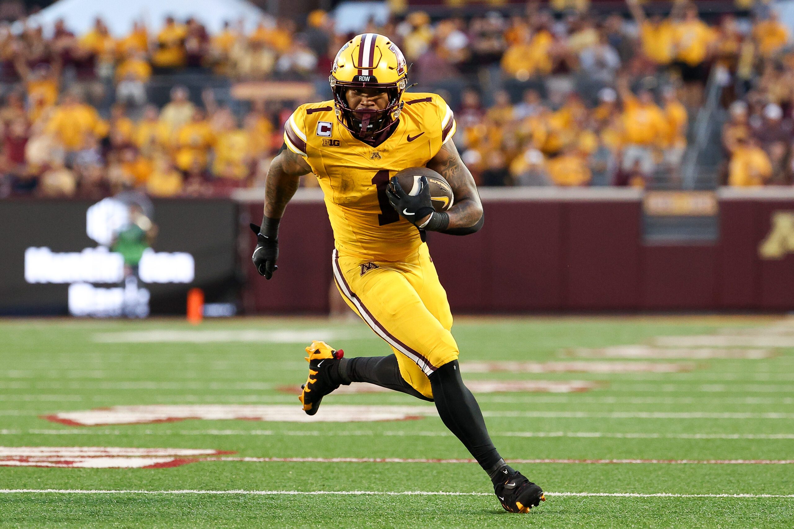 Aug 28, 2025; Minneapolis, Minnesota, USA; Minnesota Golden Gophers running back Darius Taylor (1) runs the ball against the Buffalo Bulls during the first half of the game at Huntington Bank Stadium. Mandatory Credit: Matt Krohn-Imagn Images