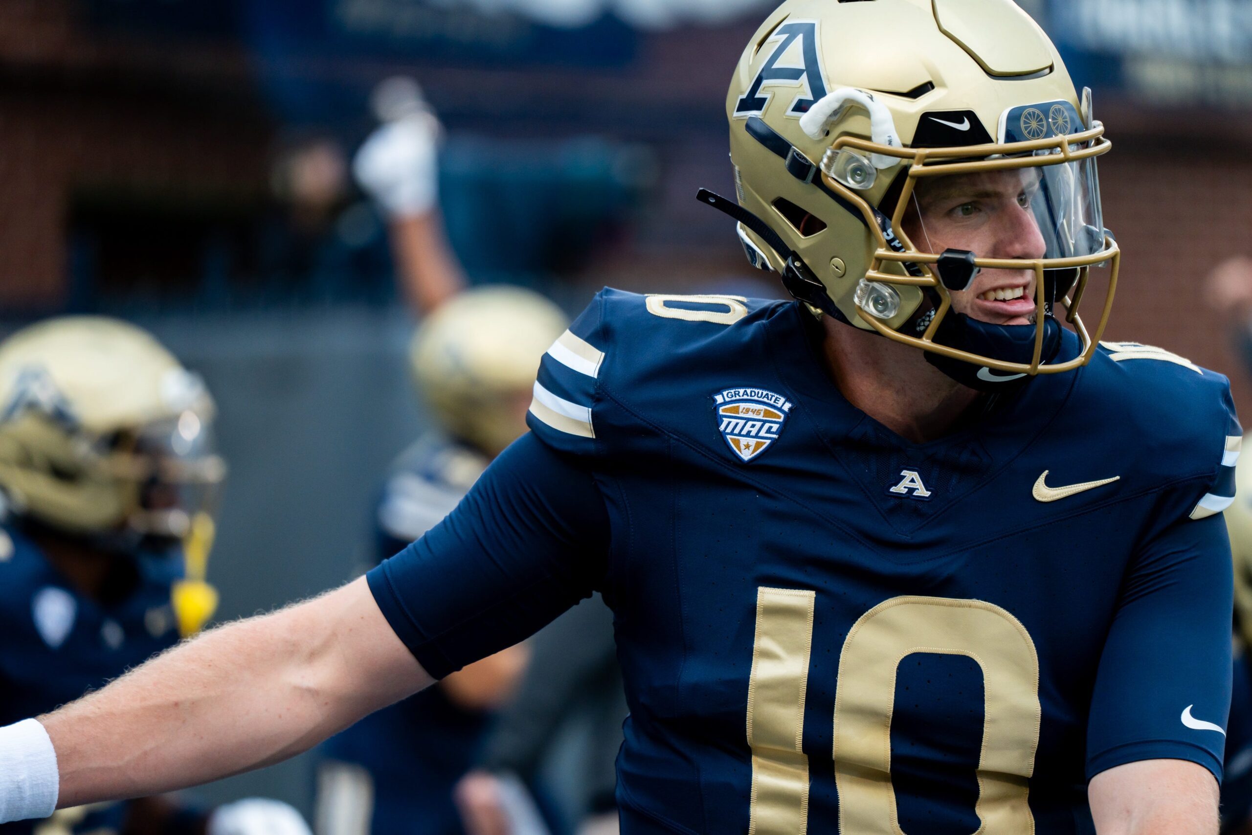 Akron Zips quarterback Ben Finley (10) stretches during warmups before the season opening game against Wyoming, Aug. 28, 2025, at InfoCision Stadium in Akron, Ohio.
