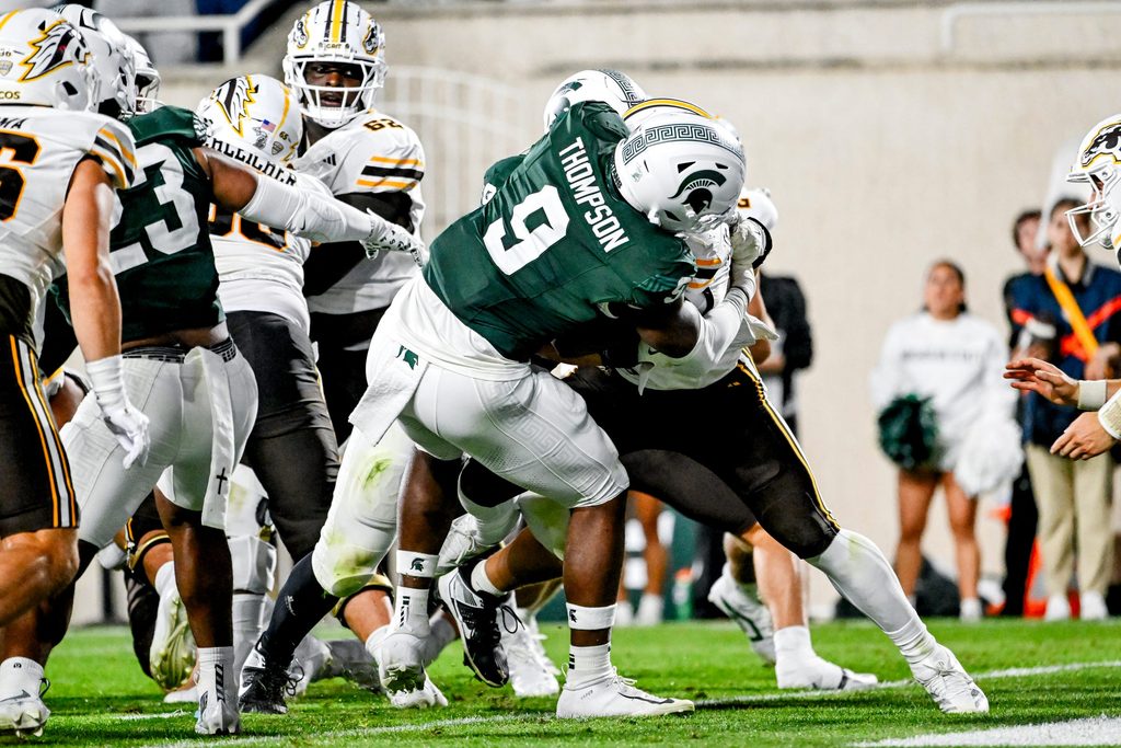 Michigan State's Jalen Thompson, left, tackles Western Michigan's Jalen Buckley for a safety during the third quarter on Friday, Aug. 29, 2025, in East Lansing.