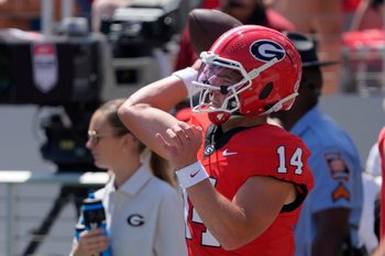 Georgia quarterback Gunner Stockton (14) warms up before the start of a NCAA college football game against Marshall in Athens, Ga., on Saturday, August. 30, 2025.