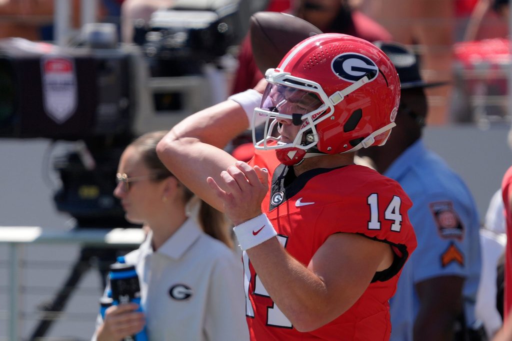 Georgia quarterback Gunner Stockton (14) warms up before the start of a NCAA college football game against Marshall in Athens, Ga., on Saturday, August. 30, 2025.