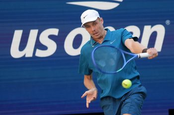 Aug 30, 2025; Flushing, NY, USA;  
Denis Shapovalov (CAN) hits to Jannik Sinner (ITA) (not pictured) on day seven of the 2025 U.S. Open tennis tournament at the USTA Billie Jean King National Tennis Center. Mandatory Credit: Robert Deutsch-Imagn Images