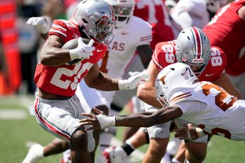 Ohio State Buckeyes running back James Peoples (20) makes Texas Longhorns linebacker Ty'Anthony Smith (26) miss while running the ball in the fourth quarter of their game at Ohio Stadium in Columbus, Ohio on Aug 30, 2025.