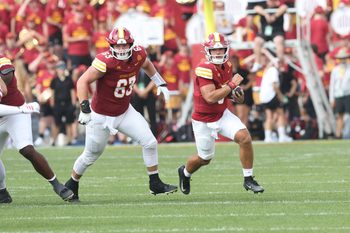 Aug 30, 2025; Ames, Iowa, USA; Iowa State Cyclones offensive lineman Jim Bonifas (63) blocks for Iowa State Cyclones quarterback Rocco Becht (3) against the South Dakota Coyotes at Jack Trice Stadium. Mandatory Credit: Reese Strickland-Imagn Images