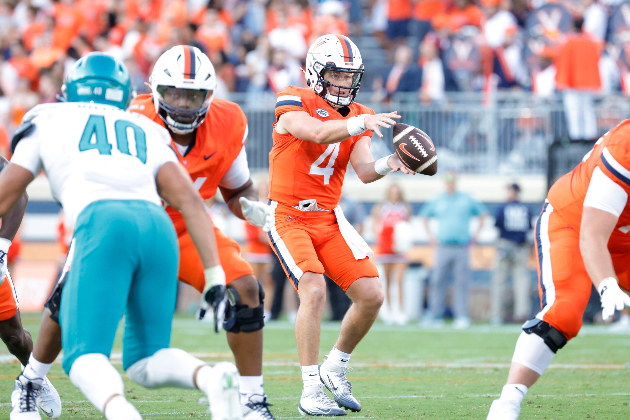 Aug 30, 2025; Charlottesville, Virginia, USA; Virginia Cavaliers quarterback Chandler Morris (4) catches a snap against the Coastal Carolina Chanticleers during the second quarter at Scott Stadium. Mandatory Credit: Amber Searls-Imagn Images