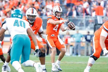 Aug 30, 2025; Charlottesville, Virginia, USA; Virginia Cavaliers quarterback Chandler Morris (4) catches a snap against the Coastal Carolina Chanticleers during the second quarter at Scott Stadium. Mandatory Credit: Amber Searls-Imagn Images