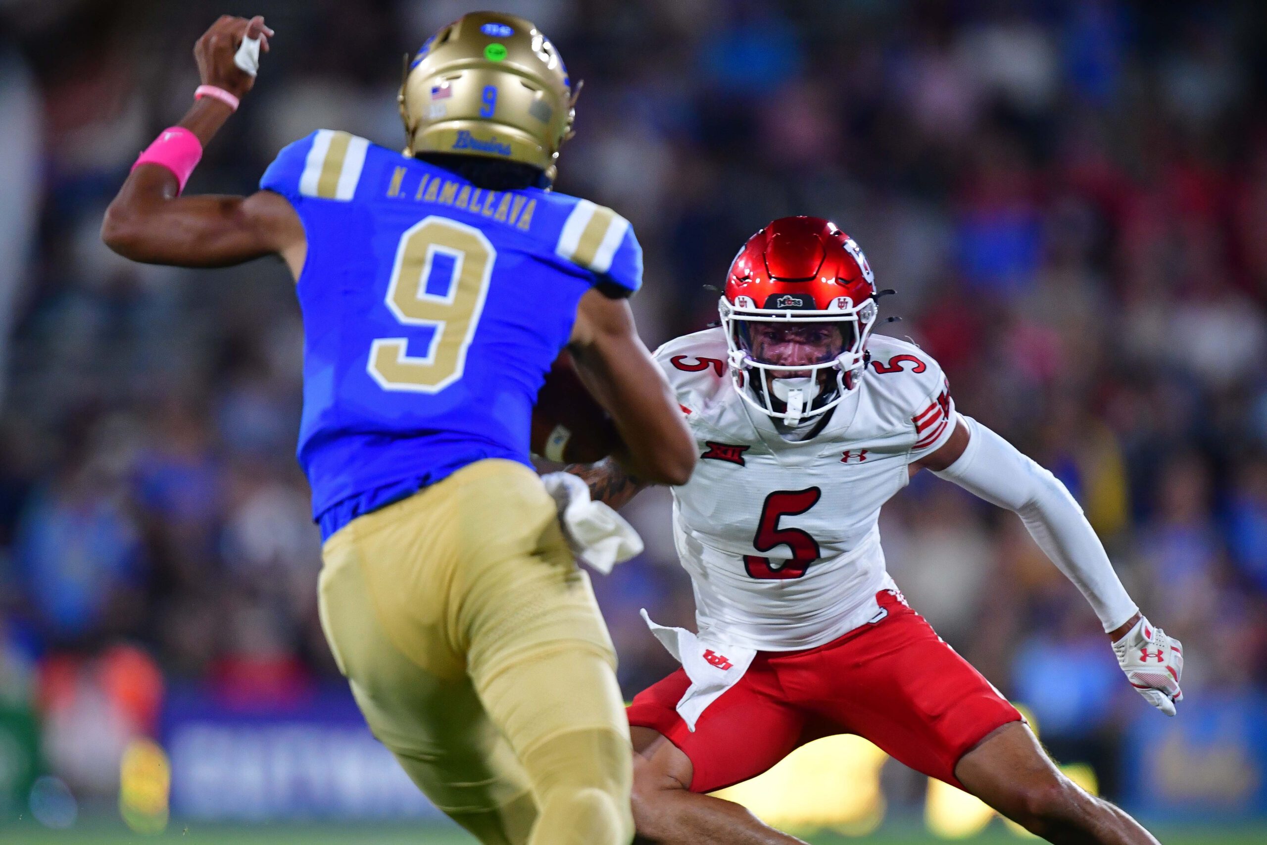 Aug 30, 2025; Pasadena, California, USA; Utah Utes safety Tao Johnson (5) moves in against UCLA Bruins quarterback Nico Iamaleava (9) during the first half at Rose Bowl. Mandatory Credit: Gary A. Vasquez-Imagn Images
