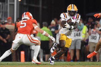 Clemson Tigers defensive back Ronan Hanafin (5) and Clemson Tigers linebacker Wade Woodaz (17) go to tackle LSU Tigers wide receiver Aaron Anderson (1) Saturday, Aug. 30, 2025 during the NCAA football game at Memorial Stadium in Clemson, South Carolina. LSU Tigers won 17-10.