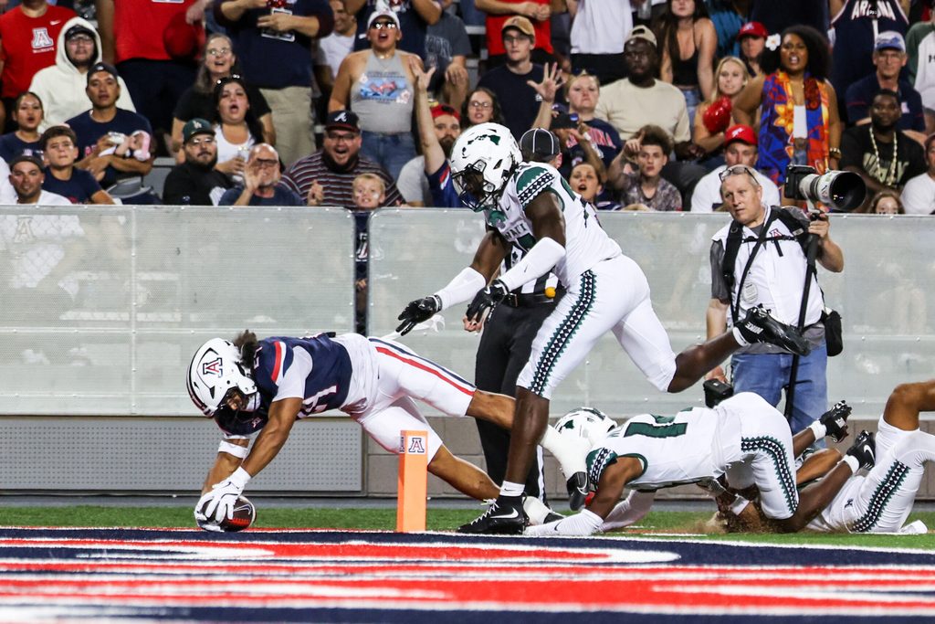 Aug 30, 2025; Tucson, Arizona, USA; Arizona Wildcats running back Quincy Craig (24) drives toward the end zone to score a touchdown during the second quarter against the Hawaii Rainbow Warriors at Arizona Stadium. Mandatory Credit: Aryanna Frank-Imagn Images