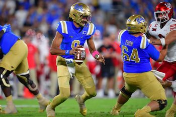 Aug 30, 2025; Pasadena, California, USA; UCLA Bruins quarterback Nico Iamaleava (9) moves out to pass as offensive lineman Sam Yoon (64) provides coverage against Utah Utes linebacker Lander Barton (8) during the second half at Rose Bowl. Mandatory Credit: Gary A. Vasquez-Imagn Images