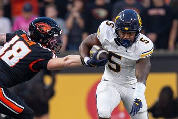 CaliforniaÕs Brandon High Jr. breaks the tackle from Oregon StateÕs Kai Wallin during an NCAA football game at Reser Stadium on Saturday, Aug. 30, 2025, in Corvallis, Ore.