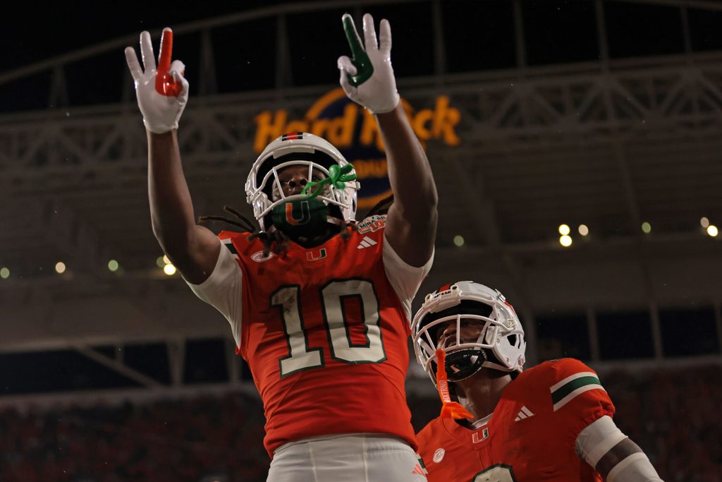 Aug 31, 2025; Miami Gardens, Florida, USA; Miami Hurricanes wide receiver Malachi Toney (10) reacts after scoring a touchdown against the Notre Dame Fighting Irish during the first quarter at Hard Rock Stadium. Mandatory Credit: Sam Navarro-Imagn Images