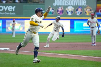 Sep 1, 2025; Milwaukee, Wisconsin, USA; Milwaukee Brewers catcher William Contreras (24) rounds third base with outfielder Christian Yelich (22) right behind him against the Philadelphia Phillies in the first inning at American Family Field. Mandatory Credit: Michael McLoone-Imagn Images