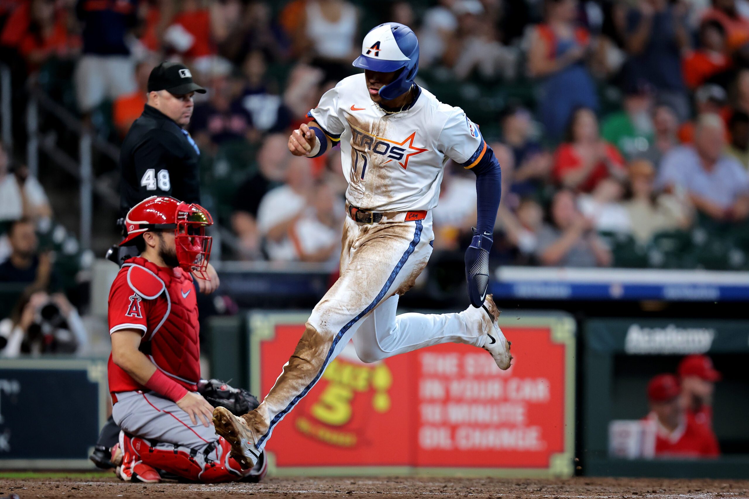 Sep 1, 2025; Houston, Texas, USA; Houston Astros right fielder Cam Smith (11) crosses home plate to score a run  against the Los Angeles Angels during the eighth inning at Daikin Park. Mandatory Credit: Erik Williams-Imagn Images