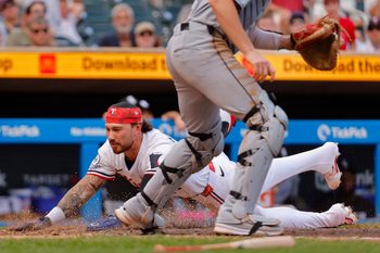 Sep 1, 2025; Minneapolis, Minnesota, USA; Minnesota Twins pinch runner DaShawn Keirsey (21) scores on a sacrifice fly against the Chicago White Sox in the sixth inning at Target Field. Mandatory Credit: Bruce Kluckhohn-Imagn Images