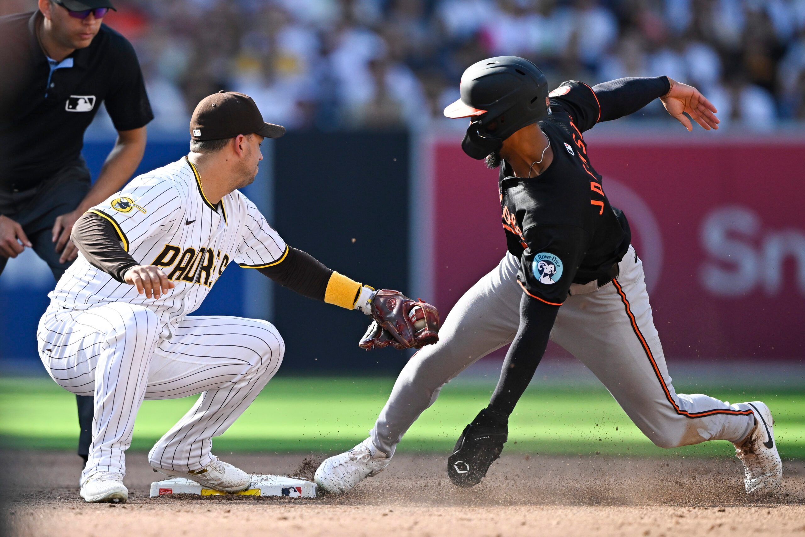 Sep 1, 2025; San Diego, California, USA; Baltimore Orioles second baseman Jeremiah Jackson (82) is tagged out by San Diego Padres second baseman Jose Iglesias (7) as he tries to steal second base during the third inning at Petco Park. Mandatory Credit: Denis Poroy-Imagn Images