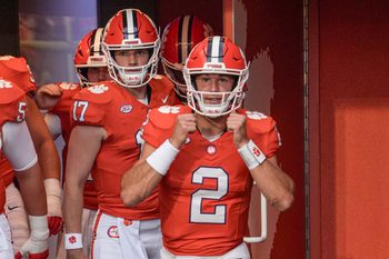 Clemson quarterback Cade Klubnik (2) and quarterback Christopher Vizzina (17) walk toward the field before the game with Clemson and Louisiana State University at Memorial Stadium in Clemson, S.C. Saturday, August 30, 2025.