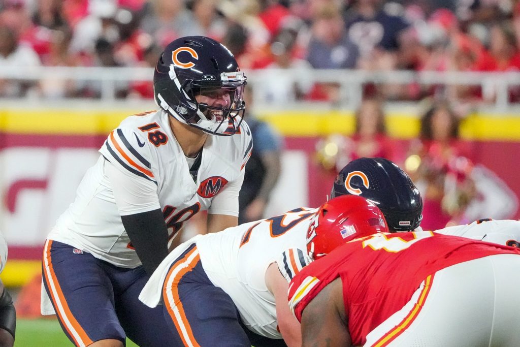 Aug 22, 2025; Kansas City, Missouri, USA; Chicago Bears quarterback Caleb Williams (18) goes under center against the Kansas City Chiefs during the game at GEHA Field at Arrowhead Stadium. Mandatory Credit: Denny Medley-Imagn Images