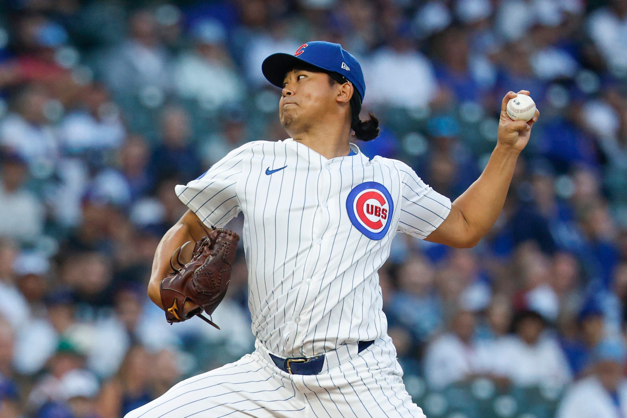 Sep 5, 2025; Chicago, Illinois, USA; Chicago Cubs starting pitcher Shota Imanaga (18) delivers a pitch against the Atlanta Braves during the first inning at Wrigley Field. Mandatory Credit: Kamil Krzaczynski-Imagn Images