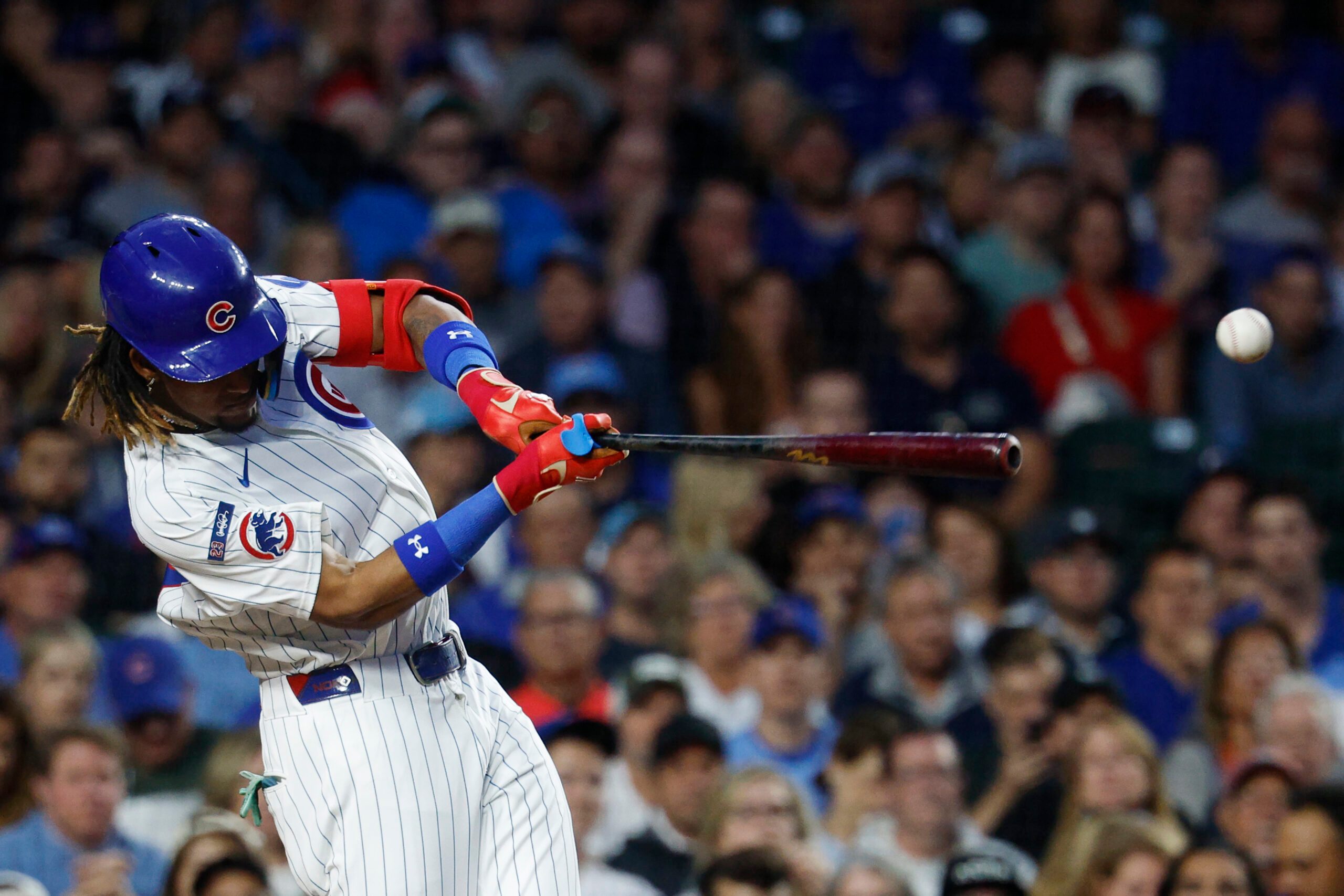 Sep 5, 2025; Chicago, Illinois, USA; Chicago Cubs center fielder Kevin Alcantara (13) singles against the Atlanta Braves during the third inning at Wrigley Field. Mandatory Credit: Kamil Krzaczynski-Imagn Images