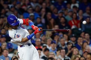 Sep 5, 2025; Chicago, Illinois, USA; Chicago Cubs center fielder Kevin Alcantara (13) singles against the Atlanta Braves during the third inning at Wrigley Field. Mandatory Credit: Kamil Krzaczynski-Imagn Images