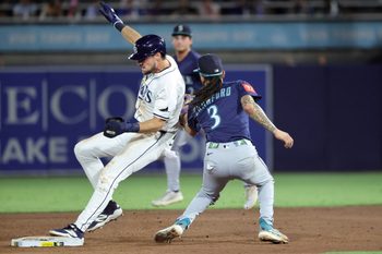 Sep 2, 2025; St. Petersburg, Florida, USA;  Tampa Bay Rays outfielder Josh Lowe (15) steals second base as Seattle Mariners shortstop J.P. Crawford (3) attempted to tag him out during the third inning at George M. Steinbrenner Field. Mandatory Credit: Kim Klement Neitzel-Imagn Images