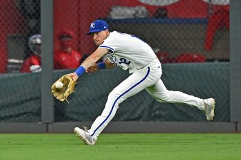 Sep 2, 2025; Kansas City, Missouri, USA;  Kansas City Royals left fielder Nick Loftin (12) makes a running catch in the ninth inning against the Los Angeles Angels at Kauffman Stadium. Mandatory Credit: Peter Aiken-Imagn Images