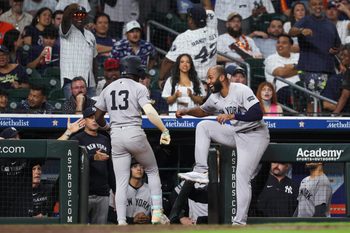 Sep 2, 2025; Houston, Texas, USA; New York Yankees second baseman Jazz Chisholm Jr. (13) celebrates with third baseman Amed Rosario (14) after hitting a home run during the eighth inning against the Houston Astros at Daikin Park. Mandatory Credit: Troy Taormina-Imagn Images