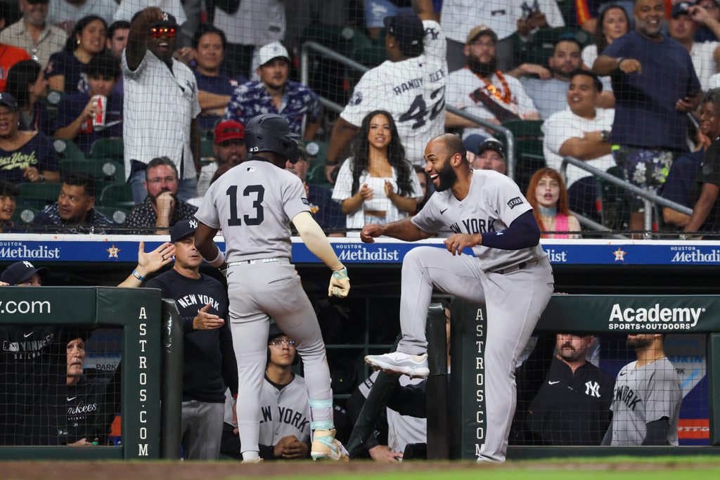 Sep 2, 2025; Houston, Texas, USA; New York Yankees second baseman Jazz Chisholm Jr. (13) celebrates with third baseman Amed Rosario (14) after hitting a home run during the eighth inning against the Houston Astros at Daikin Park. Mandatory Credit: Troy Taormina-Imagn Images